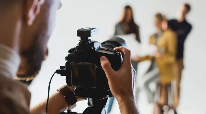 Photographer taking high-quality pictures on camera